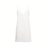Front view of the detachable white V-neck camisole slip lining with thin shoulder straps included with the dress at BLUE SALON shop.