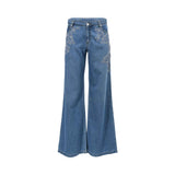 Front view of Ermanno Firenze women's wide-leg denim jeans in washed blue, detailed with white floral lace embroidery framing the upper pockets from BLUE SALON shop.