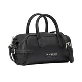Three-quarter angled studio shot of the Ermanno Firenze black barrel handbag at BLUE SALON, highlighting the rich pebbled texture and side buckle details.