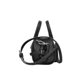 Profile side view of the Ermanno Firenze black grained handbag from BLUE SALON, detailing the side cinch-strap design and the silver-toned shoulder strap attachment.