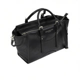 Black leather handbag with detailed design on a white background.