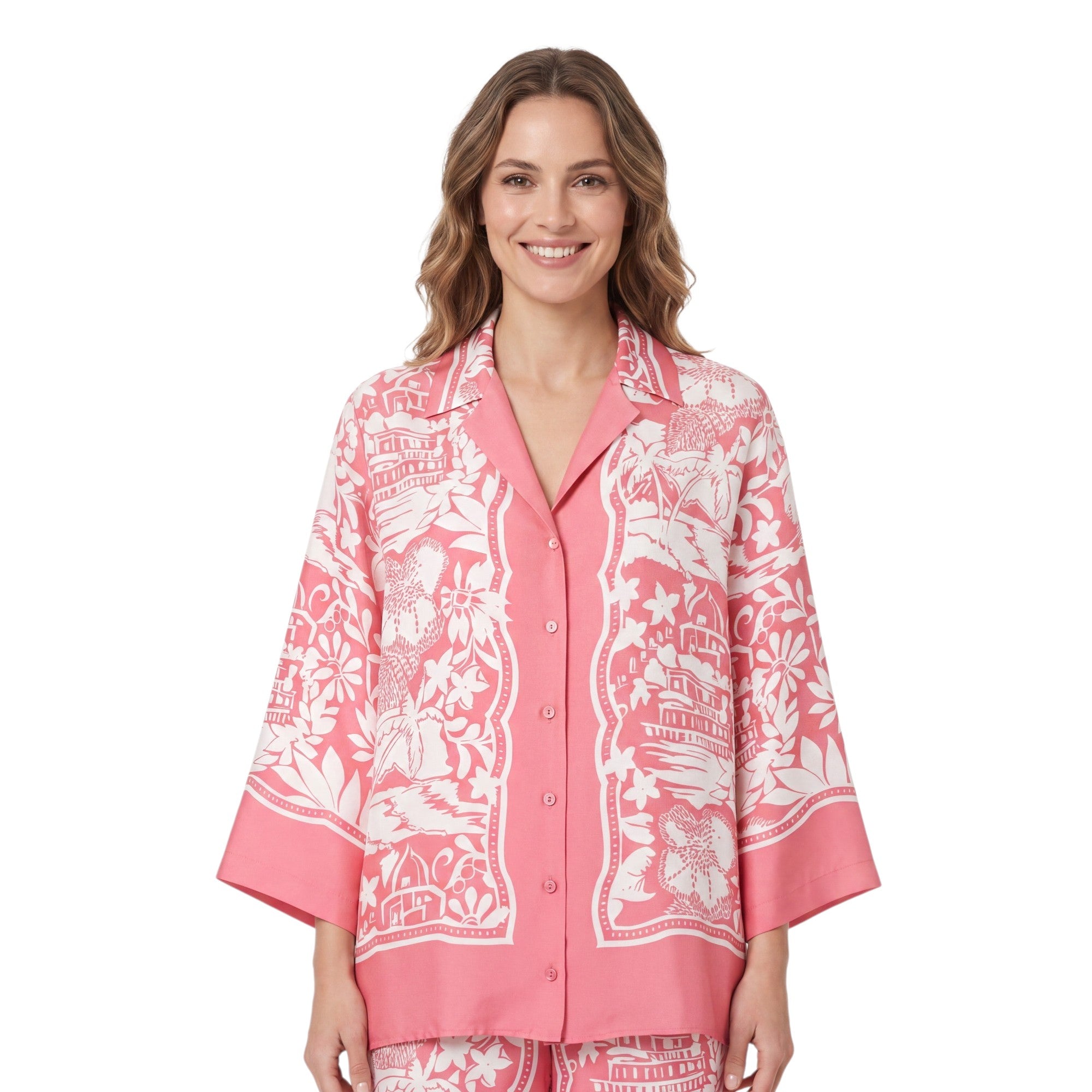 Front studio view of a smiling model wearing the Ermanno Firenze rose pink and cream tropical print pajama-style shirt from BLUE SALON shop.