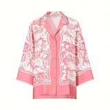 Front studio presentation of the Ermanno Firenze pink Toile de Jouy printed shirt showcasing its notched lapel collar, button closures, and wide sleeves.