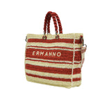 Three-quarter angled view of the Ermanno Firenze striped woven handbag at BLUE SALON, showcasing the structured side depth and attached canvas shoulder strap.