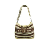 Full hanging view of the Ermanno Firenze striped handbag at BLUE SALON, suspended by its long, adjustable webbed strap featuring bold contrast branding.