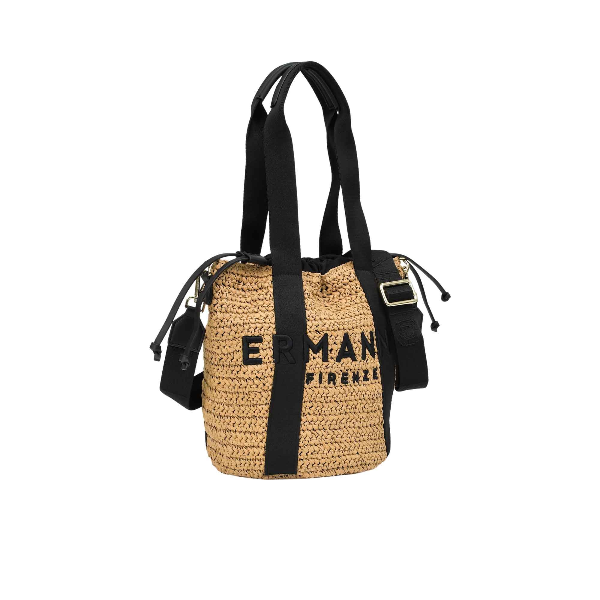 Slight three-quarter view of the Ermanno Firenze natural raffia handbag at BLUE SALON, highlighting the bucket-style silhouette and the black canvas accents.