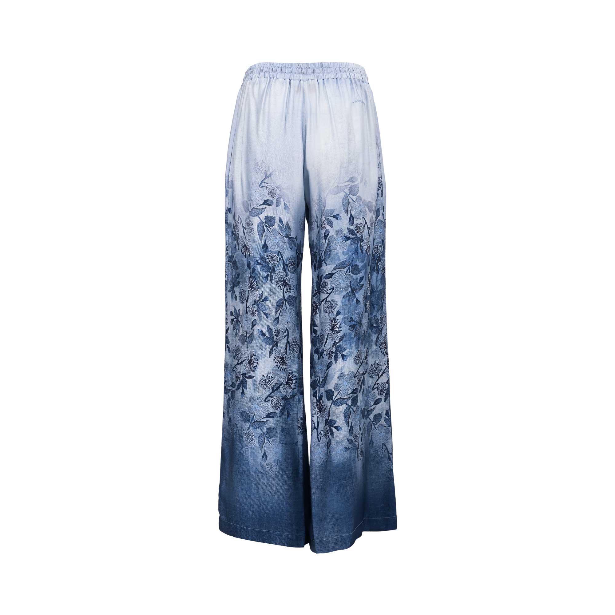 Back view of Ermanno blue ombré floral trousers highlighting the continuous botanical pattern and gathered waist, available at BLUE SALON shop.