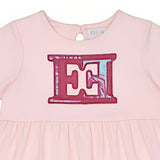 Close-up shot focusing on the upper front bodice of the Escada Kids dress, detailing the round neckline and the embroidered pink "EE" logo emblem with its abstract patterned fill.