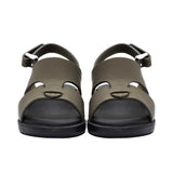 Pair of FARES brand white leather sandals with black soles and adjustable heel straps, featuring a modern geometric cutout design on a white background.