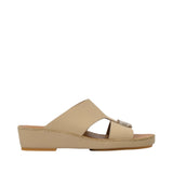 Profile view of a FARES beige leather traditional Arabian sandal showing its elevated wedge-style midsole, smooth leather upper strap, and front metallic buckle accent against a white background.