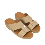 An overhead, three-quarter angle view of a pair of FARES beige sandals showing the smooth tan leather footbeds and the premium perimeter stitching along the midsoles against a white background.