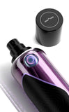 M.INT Fashion Intervention Eau de Parfum 75ml bottle with black box packaging and purple wave accents, featuring a sleek and contemporary fragrance design, Now Online.