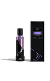 M.INT Fashion Intervention Eau de Parfum 75ml bottle with black box packaging and purple wave accents, featuring a sleek and contemporary fragrance design, Now Online.