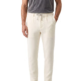 White/milk textured jogger pants for men with a grey drawstring and side pockets.