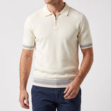 Cream short-sleeved knitted polo sweater with a silver-toned zip placket and grey striped ribbed cuffs and hem.