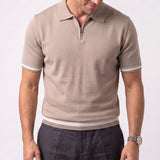 Beige short-sleeve knit polo sweater with a silver-toned quarter-zip closure, and ribbed cuffs and hem with two white stripes