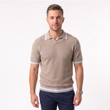 Light brown short-sleeved knitted polo shirt with a textured diagonal weave, spread collar, V-neck, and striped cuffs and hem