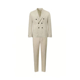 Ecru double-breasted suit. Jacket features 6 black buttons, wide lapels, two patch pockets, and 3 cuff buttons. Matching trou
