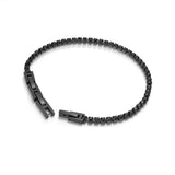 Black-finished tennis bracelet with a continuous line of small, faceted black crystals and a black clasp engraved "POLICE".