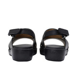 Pair of FARES brand smooth leather sandals with silver buckles and adjustable heel straps, featuring a modern minimalist design on a white background.
