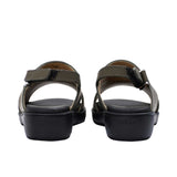 Pair of FARES brand smooth leather sandals with silver buckles and adjustable heel straps, featuring a modern minimalist design on a white background.