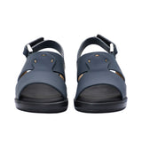 Pair of FARES kids' Arabic-style sandals in matte navy blue leather with adjustable back straps and black cushioned soles on a white background.
