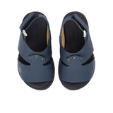 Pair of FARES kids' Arabic-style sandals in matte navy blue leather with adjustable back straps and black cushioned soles on a white background.