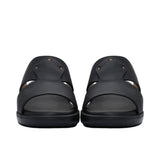 A pair of FARES kids' leather slip-on Arabic sandals with a minimalist wide-strap design and cushioned.