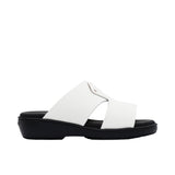 A pair of FARES kids' leather slip-on Arabic sandals with a minimalist wide-strap design and cushioned.