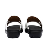 A pair of FARES kids' leather slip-on Arabic sandals with a minimalist wide-strap design and cushioned.