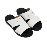 A pair of FARES kids' leather slip-on Arabic sandals with a minimalist wide-strap design and cushioned.