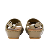 Pair of FARES  textured leather sandals with tan footbeds, visible perimeter stitching, and adjustable heel straps on a white background.