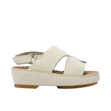 Pair of FARES  textured leather sandals with tan footbeds, visible perimeter stitching, and adjustable heel straps on a white background.