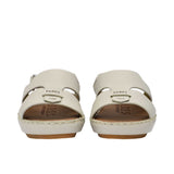 Pair of FARES  textured leather sandals with tan footbeds, visible perimeter stitching, and adjustable heel straps on a white background.