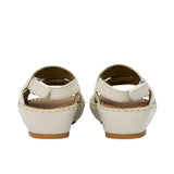 Pair of FARES  textured leather sandals with tan footbeds, visible perimeter stitching, and adjustable heel straps on a white background.