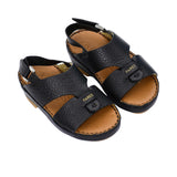 Pair of FARES  textured leather sandals with tan footbeds, visible perimeter stitching, and adjustable heel straps on a white background.