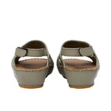 Pair of FARES  textured leather sandals with tan footbeds, visible perimeter stitching, and adjustable heel straps on a white background.