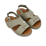 Pair of FARES  textured leather sandals with tan footbeds, visible perimeter stitching, and adjustable heel straps on a white background.