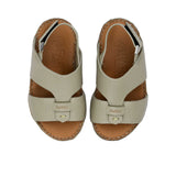 Pair of FARES  textured leather sandals with tan footbeds, visible perimeter stitching, and adjustable heel straps on a white background.