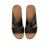 Overhead view of FARES sandals showing the brand logo on the brown leather insole.