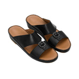 Angled top-down view of the FARES sandals highlighting the dual-strap design and leather footbed.