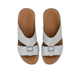 Overhead view of FARES sandals showing the brand logo on the brown leather insole.