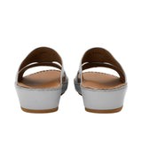 Rear view showing the heel elevation and leather lining of the FARES sandals.