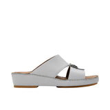 Side view of a FARES leather sandal showing the platform midsole and hand-sewn stitching.