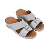 Angled top-down view of the FARES sandals highlighting the dual-strap design and leather footbed.