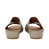 Rear view showing the heel elevation and leather lining of the FARES sandals.