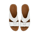 Overhead view of FARES sandals showing the brand logo on the brown leather insole.