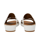 Rear view showing the heel elevation and leather lining of the FARES sandals.