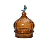 Favorite Glass solid amber dome ornament with green moon accent. Available Now Online