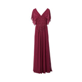 Floor-length chiffon evening dress by Fiordelli Donna, featuring sheer flutter sleeves and a cinched waist decorated with vertical lines of crystals and beads.